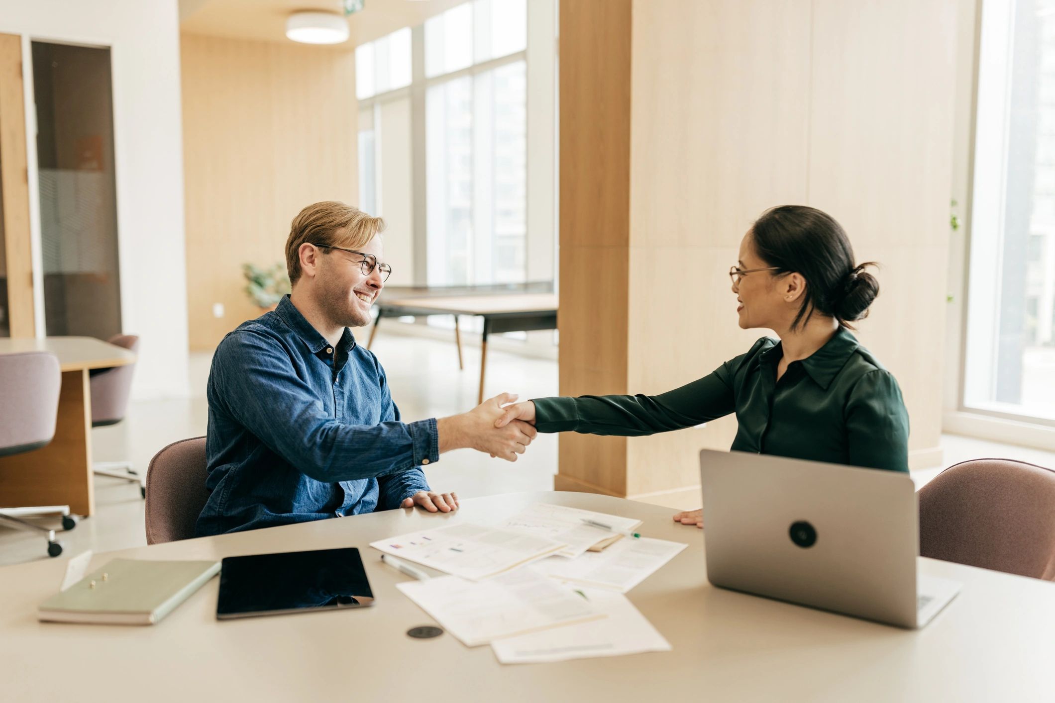 Professionals shaking hands during a business meeting